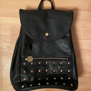 Backpack soft leather look with gold accents and studs. Cool purple satin lining